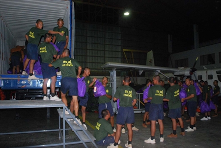 Sailors at the Air and Coastal Defense Command load up supplies to take to flood victims in the north.